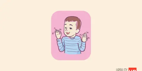 Bambino con autismo che fa stimming, muovendo le mani con gioia.