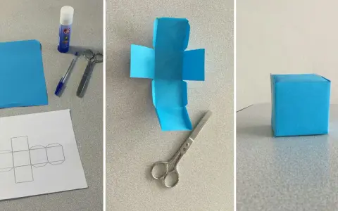 Creazione di un cubo fai da te: carta blu, forbici, colla e modello per un progetto creativo.