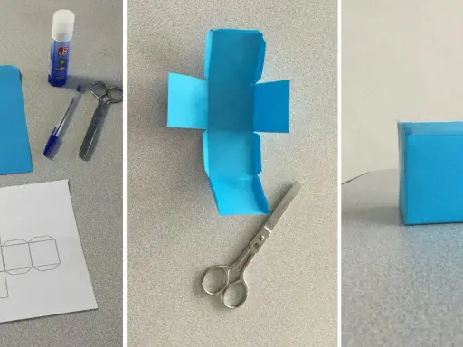 Creazione di un cubo fai da te: carta blu, forbici, colla e modello per un progetto creativo.