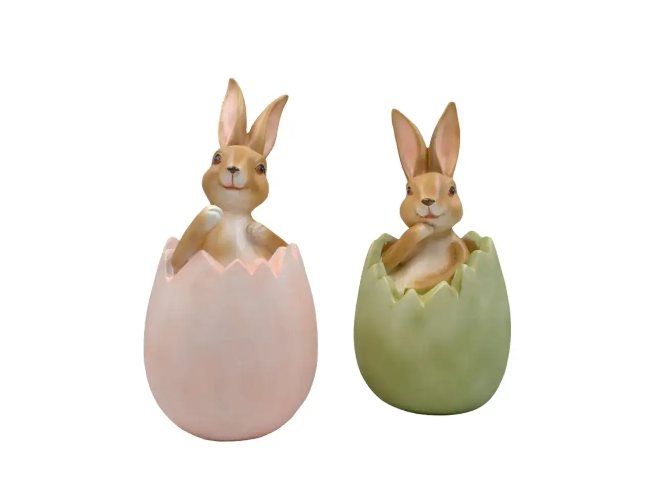 Due coniglietti pasquali emergono da gusci d'uovo color pastello, pronti a iniziare la loro storia.